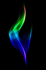 Abstract colorful smoke isolated on black background.