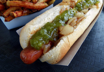 Footlong hot dog and French fries closeup