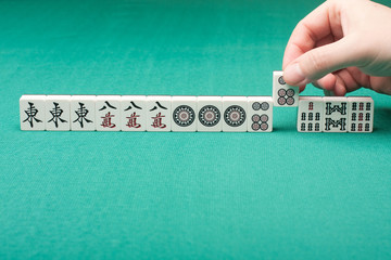 Smooth table surface with a mahjong on it
