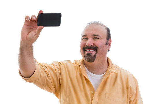 Happy man taking a self portrait on his mobile