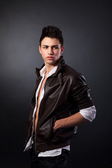 Fototapeta premium Healthy muscular young man on grey background