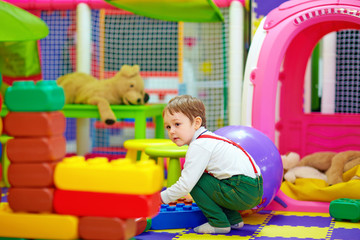 happy kid playing with toys in kindergarten © Olesia Bilkei