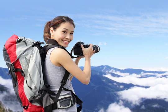 woman mountain hiker taking pictures