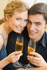 Cheerful couple with champagne