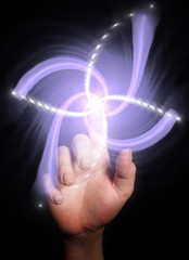 Hand pointing behind shiny swirl