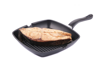 Grilled carp steak on pan.
