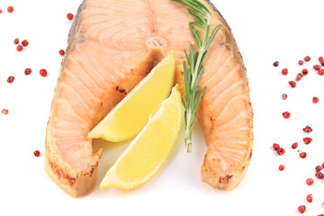 Fresh salmon steak with lemon and pepper.