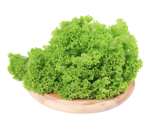 Fototapeta premium Fresh lettuce on wooden platter.