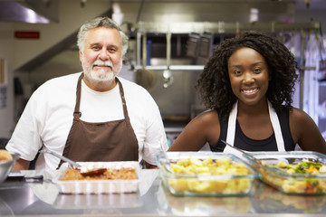 Portrait Of Kitchen Staff In Homeless Shelter - Powered by Adobe