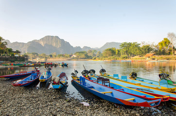 long tail boats on Song river, Vang Vieng,Laos - obrazy, fototapety, plakaty