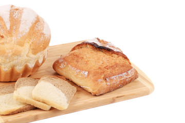 Composition of bread on cutting board.