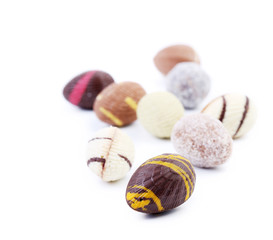 Bunch of chocolate seashells and stones.