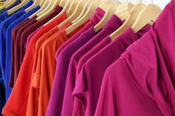 Variety of female colorful clothes on Hangers