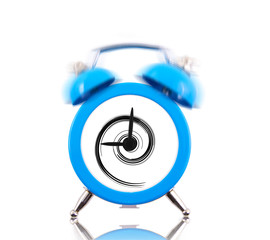Classic alarm clock ringing with swirl inside isolated