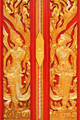 thai golden carving art on the door temple