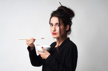 Fototapeta premium Girl eat chinese food