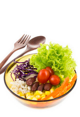 Delicious salad on a bowl with wooden spoon and fork  isolated o