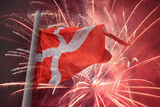 flag of Denmark over fireworks