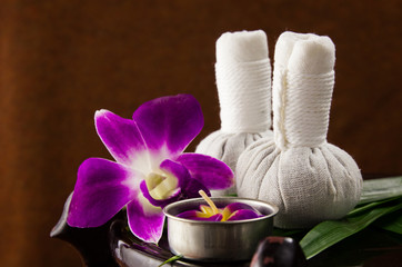 Spa herbal compressing ball with candles and orchid