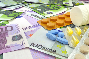 Tablets on money background