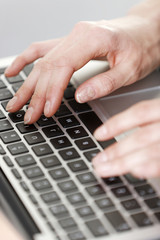 Woman typing on keyboard