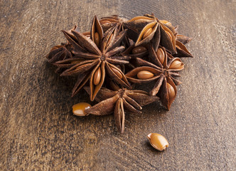 Star anise on wooden background