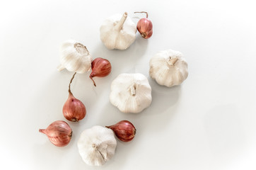 Garlic in the cup on white background
