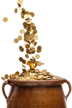 gold coins falling in the vintage pot