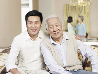 portrait senior father and adult son