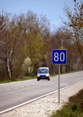 country road and speed limit sign 