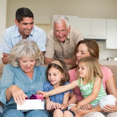 Family with gifts in sitting room
