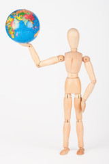 Brown wood mannequin holding concerned a globe protect