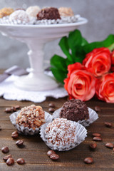 Set of chocolate candies on table on grey background