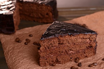 Delicious chocolate cake on table close-up