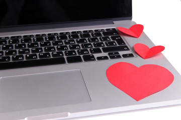 Red hearts on computer keyboard close up