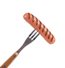 Grilled sausage on a fork.
