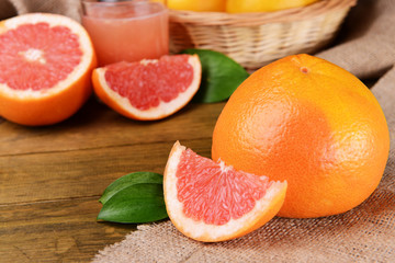 Naklejka na ściany i meble Ripe grapefruit on table close-up