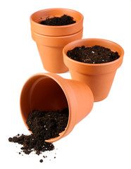 Clay flower pots and soil, isolated on white