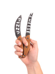 Hand holds two knifes