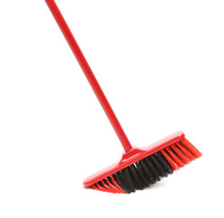 Close up of red black broom