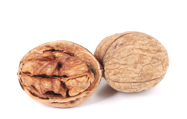 Crushed walnuts on white background