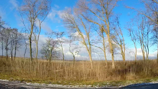 Spring Driving View with Last Snow, Dramatic Blue Skies and Clou