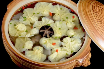 Fotobehang Chinese Food:Boiled dumplings in a pot © bbbar