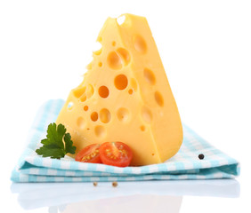 Piece of cheese and tomatoes,on color napkin, isolated on white