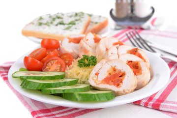 Delicious chicken roll on plate on table close-up