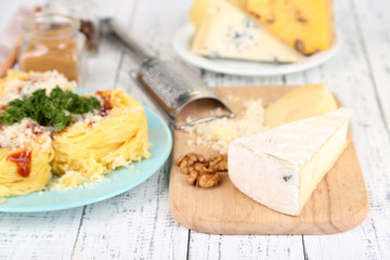 Composition with tasty spaghetti, grater, cheese,