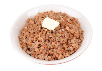 Boiled buckwheat in bowl isolated on white