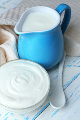 Dairy products on wooden table background