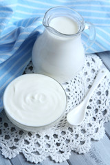 Dairy products on wooden table background