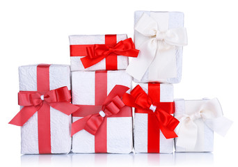 Beautiful gifts with red ribbons, isolated on white